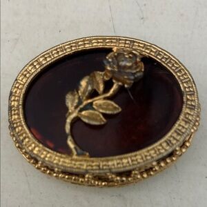 Vintage Max Factor solid perfume oval container. Goldtone, with amber inset .